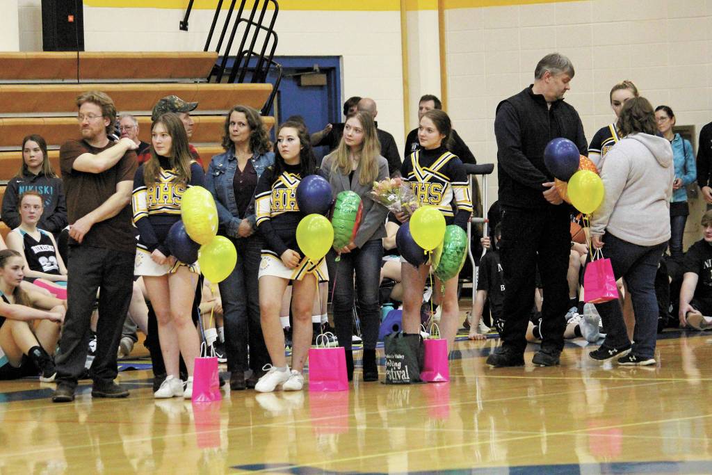 Seniors on the Homer basketball cheer squad are honored in a senior night ceremony between the girls and boys games against Nikiski on Friday, Feb. 28, 2020 in the Alice Witte Gymnasium in Homer, Alaska. (Photo by Megan Pacer/Homer News)