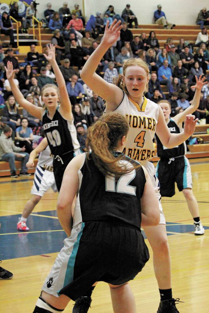 Kelli Bishop guards Nikiskis Kaycee Bostic during a Friday, Feb. 28, 2020 basketball game in the Alice Witte Gymnasium in Homer, Alaska. (Photo by Megan Pacer/Homer News)