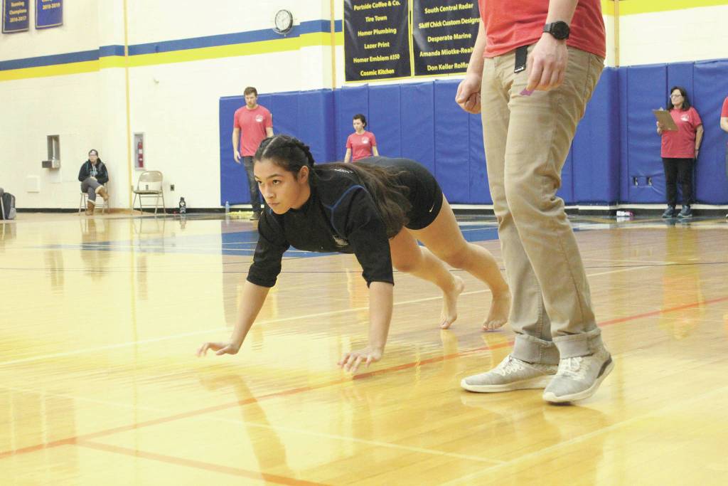 Sewards Chloe Lastimosa competes in the seal hop at the Kachemak Bay Traditional Games, a Native Youth Olympics invitational, on Saturday, March 7, 2020 at Homer High School in Homer, Alaska. (Photo by Megan Pacer/Homer News)