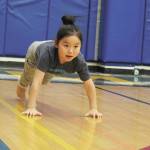 Kyree Sagoonick competes in the seal jop for junior girls Saturday, March 7, 2020 during the Kachemak Bay Traditional Games at Homer High School in Homer, Alaska. (Photo by Megan Pacer/Homer News)