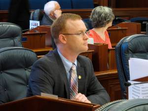 Alaska Rep. David Eastman sits at his desk on the Alaska House floor on Thursday, March 5, 2020, in Juneau, Alaska. The House voted Thursday to remove Eastman, a Wasilla Republican, from committee positions after House Minority Leader Lance Pruitt indicated frustrations with Eastman within the GOP caucus. (AP Photo/Becky Bohrer)