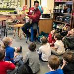 Superintendent John OBrien reads to students at Mountain View Elementary. (Photo courtesy of the Kenai Peninsula Borough School District Communications Blog/Pegge Erkeneff)