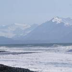 Two surfers watch for good waves at Bishops Beach on Sunday, March 22, 2020, in Homer, Alaska. (Photo by Michael Armstrong/Homer News)