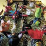 Decorative masks made by Fireweed Academy students hang in K-Bay Caffe during an art exhibit opening on Thursday, March 5, 2020 in Homer, Alaska. The masks were made with the help of Artist in the Schools Program participant Gail Baker. (Photo by Megan Pacer/Homer News)