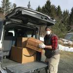 Michelle Melchert unloads personal protective gear donated by the Kachemak Bay Campus at South Peninsula Hospitla on Marh 25, 2020, in Homer, Alaska. (Photo courtesy Susan Kaplan)