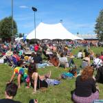 Spectators relax while listening to a musician at the Ocean Stage at last years Salmonfest on Friday, Aug. 2, 2019 in Ninilchik, Alaska. (Photo by Megan Pacer/Homer News)