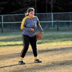 Photo courtesy Bill Bell                                 Kaitlyn Johnson plays with her teammates on the Homer softball team in this undated photo.