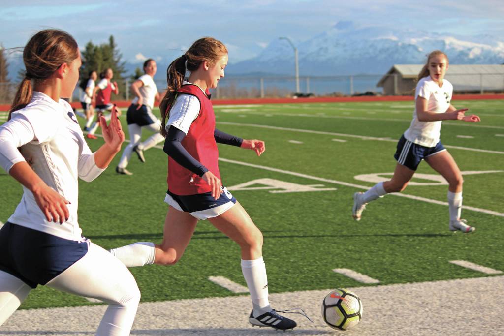 Homers Eve Brau takes the ball up the field during a game against Soldotna High School on April 9, 2019 in Homer, Alaska. (Photo by Megan Pacer/Homer News)