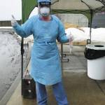 Erica Douglas, RN, holds sterile respiratory swab applicators, used for testing COVID-19, at the outdoor testing site near South Peninsula Hospitals main entrance in Homer, Alaska. (Photo courtesy Derotha Ferraro)