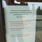 A sign on the door of Alaskan Cannabis Outfitters, a new cannabis retail store, advises social distancing and safe practices. Frontier CBD provided hand sanitizer for the store. The store is located right at Mile 168 Sterling Highway just before the road turns toward Baycrest Hill. The store opened on 4/20  April 20, 2020  in Homer, Alaska. (Photo by Michael Armstrong/Homer News)