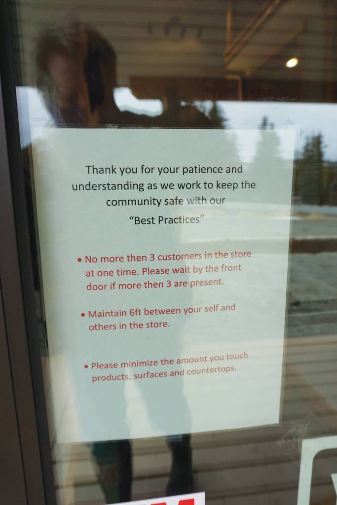 A sign on the door of Alaskan Cannabis Outfitters, a new cannabis retail store, advises social distancing and safe practices. Frontier CBD provided hand sanitizer for the store. The store is located right at Mile 168 Sterling Highway just before the road turns toward Baycrest Hill. The store opened on 4/20  April 20, 2020  in Homer, Alaska. (Photo by Michael Armstrong/Homer News)