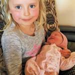 Big sister Violet Sullivan holds her new baby sister, Frances Frankie Eleanor Sullivan, born to Tessa and Mike Sullivan on April 17, 2020 in Homer, Alaska. (Photo courtesy Tessa Sullivan)