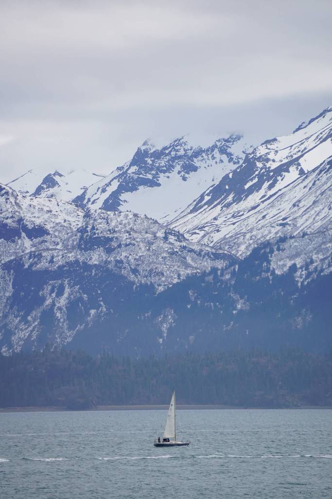 A sailboat cruises by the Spit on Saturday, April 18, 2020, in Homer, Alaska. (Photo by Michael Armstrong/Homer News)