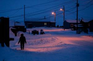 AP Photo | Gregory Bull, File                                 A woman walks before dawn in Toksook Bay, Alaska, a mostly Yupik village on the edge of the Bering Sea. A judge has ruled in favor of tribal nations in their bid to keep Alaska Native corporations from getting a share of $8 billion in coronavirus relief funding  at least for now. In a decision issued late Monday, April 27, U.S. District Judge Amit Mehta in Washington, D.C., said the U.S. Treasury Department could begin disbursing funding to 574 federally recognized tribes to respond to the coronavirus but not to the corporations.