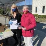 Seldovia Village Tribe CEO Crystal Collier, left, and SVT Health and Wellness Center Prevention Coordinator Shannon Custer, right, conduct free COVID-19 testing on Wednesday, April 29, 2020 in Seldovia, Alaska. (Photo courtesy Seldovia Village Tribe)