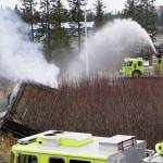 Homer Volunteer Fire Department firefighters on Friday, May 1, 2020, put out a fire in a trailer of trash that jackknifed while being hauled out after it caught fire inside the Homer Transfer Station in Homer, Alaska. (Photo by Michael Armstrong/Homer News)