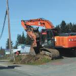 Construction work is performed at the corner of Pioneer Avenue and Svedlund Street on Wednesday, May 13, 2020 in Homer, Alaska. (Photo by Megan Pacer/Homer News)