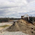 Brian Mazurek / Peninsula Clarion                                Construction crews work along the Kenai Spur Highway in Kenai on Tuesday.
