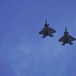 Two of four F-22 Raptors from the U.S. Air Force 3rd wing, Joint Base Elmendorf Richardson, fly over downtown Homer, Alaska on Friday, May 15, 2020, as part of an exercise to honor Alaska first responders and health care workers. (Photo by Michael Armstrong/Homer News)