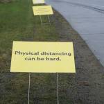 Signs on May 7, 2020, along the Sterling Highway by St. Augustines Episcopal Church in Homer, Alaska, and put up by the South Kenai Peninsula Resiliency Coalition offer encouragement during the COVID-19 pandemic. The signs read Physical distancing can be hard. Everyday connections are so important. How can you make someone smile today? (Photo by Michael Armstrong/Homer News)