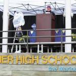 Pam Ruglowski gives part of the commencement address at Homer High Schools graduation ceremony Monday, May 18, 2020 on a stage set up outside the school in Homer, Alaska. (Photo by Megan Pacer/Homer News)