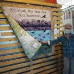 Grace Ridge Brewery co-owner Sherry Stead shows the back side of a quilt by Patrice Krant and Karrie Youngblood commemorating the 50th anniversary of Kachemak Bay State Park on Saturday, May 16, 2020, at Grace Ridge Brewery in Homer, Alaska. Krant designed and sewed the quilt and Youngblood did the quilting. (Photo by Michael Armstrong/Homer News)