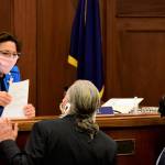 Senate President Cathy Giessel, R-Anchorage, speaks with Sens. Tom Begich, D-Anchorage, and Lyman Hoffman, D-Bethel, before the start of the floor session on Wednesday, May 20, 2020. Senators remained in Juneau to vote on a bill passed by the House Tuesday ratifying Gov. Mike Dunleavys distribution of federal relief money. (Peter Segall | Juneau Empire)