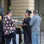 Denali Jackson receives her diploma from her mom, Leah, during the Connections Homeschool Class of 2020 graduation at Soldotna Elementary School in Soldotna, Alaska on May 21, 2020. (Photo by Brian Mazurek/Peninsula Clarion)