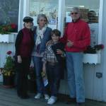 Sophie Samuzeau poses with with her son and Homer host parents Flo Larson, far left, and Peter Larson, far right, in a 2012 photo. (Photo courtesy Flo Larson)