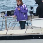 Kelly Cooper delivers her Rally on the Bay campaign kick-off speech on Tuesday, May 26, 2020, from the stern of the F/V Sea Nymph in Kachemak Bay near the Deep Water Dock in Homer, Alaska. About 50 people attended the rally from onshore, in fishing and pleasure boats, and in kayaks. (Photo by Michael Armstrong/Homer News)