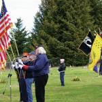 Eileen Faulkner delivers the Memorial Day address on Monday, May 25, 2020, at the Hickerson Memorial Cemetery on Diamond Ridge near Homer, Alaska. Standing next to her are color guards from the Homer and Ninilchik American Legions and the Anchor Point Veterans of Foreign War (Photo by Michael Armstrong/Homer News)