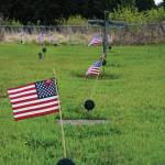 American flags decorate the graves of veterans buried in the Hickerson Memorial Cemetery on Diamond Ridge near Homer, Alaska. Memorial Day observances were held at the cemetery on Monday, May 25, 2020. The war dead include men and women who served in every U.S. war since World War I. (Photo by Michael Armstrong/Homer News)