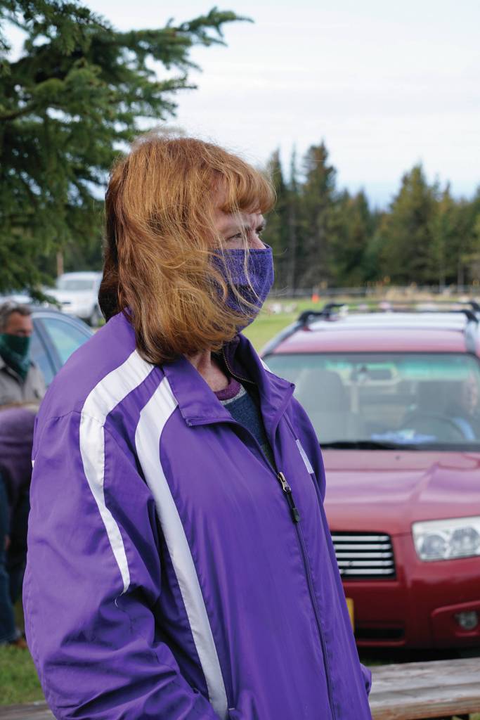 Kenai Peninsula Borough Assembly President Kelly Cooper listens to Memorial Day observances held at the Hickerson Memorial Cemetery on Diamond Ridge near Homer, Alaska, on Monday, May 25, 2020. (Photo by Michael Armstrong/Homer News)