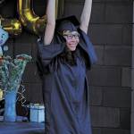 Ninilchik School graduate Anastacia Mata celebrates collecting her diploma in a Wednesday, May 20, 2020 alternative graduation ceremony at the school in Ninilchik, Alaska. (Photo by Megan Pacer/Homer News)