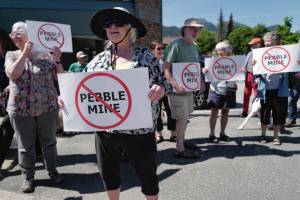 Judy Cavanaugh stands with others at a rally against the Pebble Mine in front of Sen. Lisa Murkowskis Juneau office on Tuesday, June 25, 2019. (Michael Penn | Juneau Empire File)