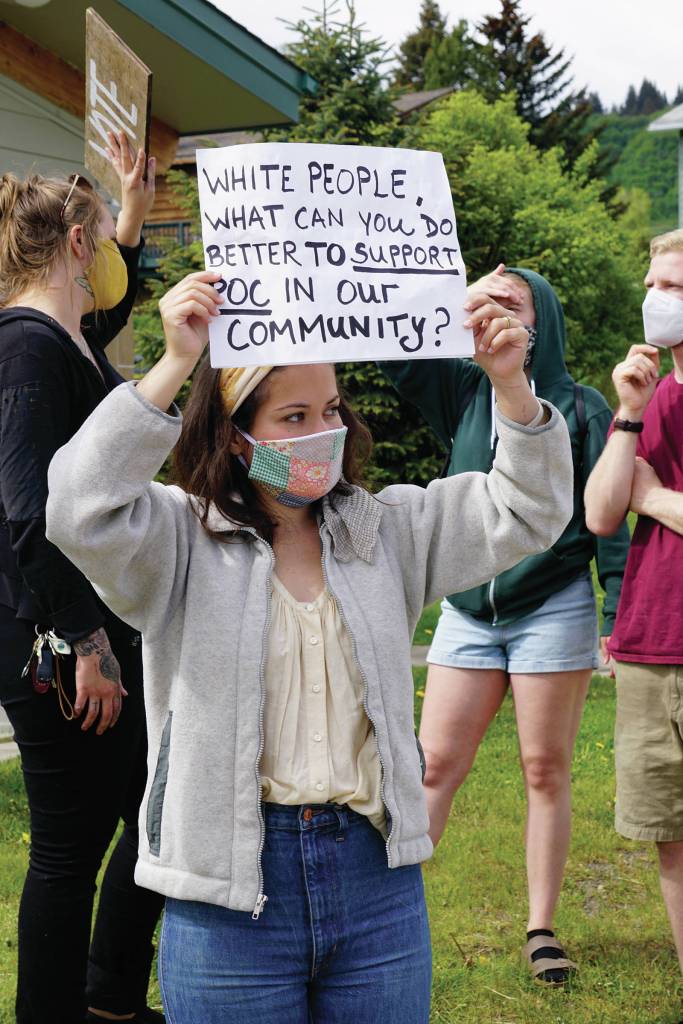 Karianna Ford holds a sign at a protest on Sunday, May 30, 2020, at WKFL Park in Homer, Alaska, in support of people of color who have been the subject of police violence, including George Floyd, a man who died May 25, 2020, in a police encounter in Minneapolis, Minnesota.