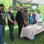 A group of supporters, volunteers, and Alaska Department of Natural Resources staff celebrate the 50th anniversary of Kachemak Bay State Park during a small gathering Saturday, June 6, 2020 at the Homer Chamber of Commerce & Visitor Center in Homer, Alaska. (Photo by Megan Pacer/Homer News)
