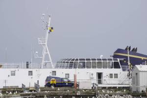 A quarantine or Lima flag of yellow-and-black flies from the M/V Tustumena on Friday, June 12, 2020, at the Pioneer Dock in Homer, Alaska. Seven crew members tested positive for COVID-19, and as of Friday three of them remained quarantined on the state ferry. (Photo by Michael Armstrong/Homer News)