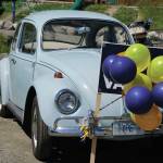 Eileen Beckers 1967 Type 1 Volkswagen Beetle holds a Vote Vance yard sign at a campaign rally for Rep. Sarah Vance, R-Homer, on Sunday, June 14, 2020, at Karen Hornaday Park in Homer, Alaska. (Photo by Michael Armstrong/Homer News)