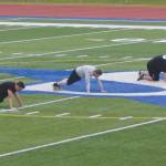 Soldotna football head coach Galen Brantley Jr. takes players through drills for sprint mechanics Wednesday, June 17, 2020, at Justin Maile Field at Soldotna High School in Soldotna, Alaska. (Photo by Jeff Helminiak/Peninsula Clarion)