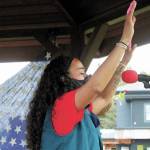 Winter Marshall-Allen, a local teacher and co-organizer of Homers first Juneteenth celebration, raises her hands while singing along to a faith song at the Friday, June 19, 2020 celebration at WKFL Park in Homer, Alaska. (Photo by Megan Pacer/Homer News)