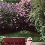An Adirondack chair at Rosemary Fitzpatricks deck offers a front row seat for the lilac and bird show as seen on June 30, 2020, at her Homer, Alaska home. (Photo by Rosemary Fitzpatrick)