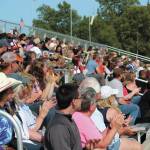Members of the crowd at this years Ninilchik Rodeo cheer during an event Saturday, July 4, 2020 at the Kenai Peninsula Fairgrounds in Ninilchik, Alaska. The rodeo celebrated 60 years with a rooted in history theme. (Photo by Megan Pacer/Homer News)