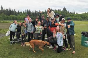 Eve Brau, Ivy Bloom, Maggie LaRue, Kenneth Schneider, Mary Bowe, Flynn Bloom, Elsie Smith, Hannah LaRue, Ryan Eckert, Melanie Fay, Tommy Bowe, Joe Ravin, Douglas Dean, Michael Swoboda, Jordan Raymond and James Reid celebrate their victory as the winners of the Homer Softball Leagues championship tournament the weekend of July 25-26, 2020 in Homer, Alaska. (Photo courtesy Heath Smith)