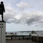 The Captain James Cook statue facing the inlet that bears his name and fronts Alaskas largest city in downtown Anchorage is seen on June 23, 2020. Far away from Confederate memorials, Alaska residents have joined the movement to eliminate statues of colonialists accused of abusing and exploiting Indigenous people. The effort has already resulted in a statue of Russian America colonialist Alexander Baranov being taken out of public view in one city. Others want statutes removed of U.S. Secretary of State and Alaska purchase architect William Seward and Capt. James Cook. (AP Photo/Mark Thiessen)