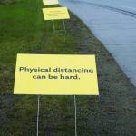 Signs on May 7, 2020, along the Sterling Highway by St. Augustines Episcopal Church in Homer, Alaska, and put up by the South Kenai Peninsula Resiliency Coalition offer encouragement during the COVID-19 pandemic. The signs read Physical distancing can be hard. Everyday connections are so important. How can you make someone smile today? (Photo by Michael Armstrong/Homer News)