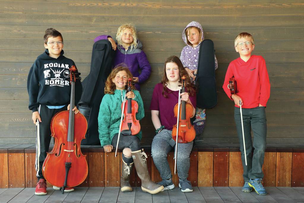 The Bayside Buskers pose on June 26, 2020, in the Homer Boathouse at the harbor in Homer, Alaska. (Photo by Aaron Christ)