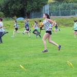 Members of the Homer High School cross country team perform warm up drills at a practice Tuesday, Aug. 18, 2020 at the school in Homer, Alaska. (Photo by Megan Pacer/Homer News)