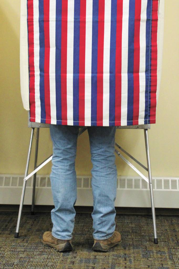 A voter fills out his ballot during the Primary Election on Tuesday, Aug. 18, 2020 at Homer City Hall in Homer, Alaska. (Photo by Megan Pacer/Homer News)