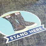 A floor marker shows voters where to stand to maintain a safe distance between each other during the Primary Election on Tuesday, Aug. 18, 2020 at Homer City Hall in Homer, Alaska. (Photo by Megan Pacer/Homer News)